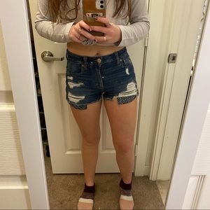 Medium washed distressed jean shorts